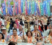 6000 people come together from across the globe, enjoy samba and hula in a parade in Kokusai Street